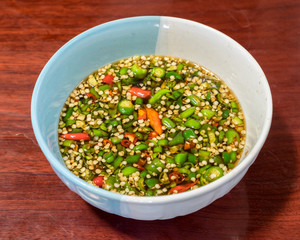 Garnish chilli sliced on salt sauce in cup