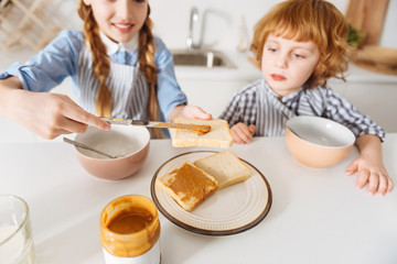 Obraz na płótnie Canvas Admirable active siblings having a nutritious breakfast
