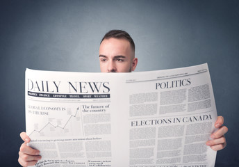 Businessman reading newspaper