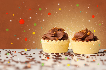 Sweet tasty cakes with colorful background and bokeh light