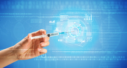 Fototapeta premium Female doctor holding syringe