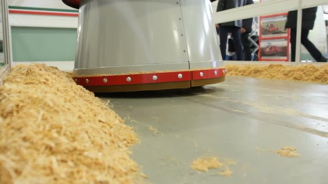 Agricultural robot removes hay from the barn - high technology for farmers