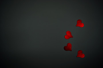 Red hearts and black background