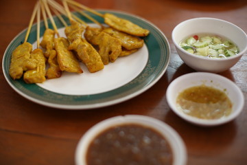 Selective focus of pork Sate with Peanut Dipping Sauce recipe 