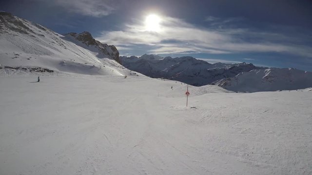 4k alpine skiing footage, ski helmet point of view. Downhill from the ski slopes. Ponte di Legno Tonale, Italy