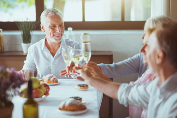Positive family enjoying celebration at home.