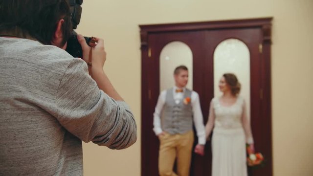 Wedding photographer - young married couple indoor