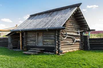 Fototapeta na wymiar The old wooden shed of logs. Russia. Urals. Nizhnya Sinyachikha.