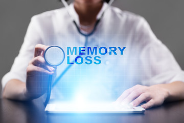 Medical doctor working with modern computer and pressing button memory loss. Medical concept.