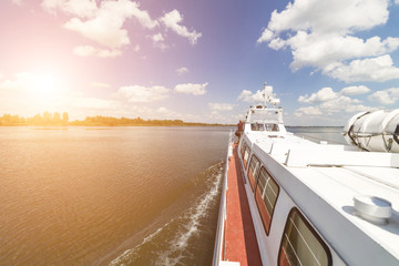 Walking tourist ship sails on the lake.