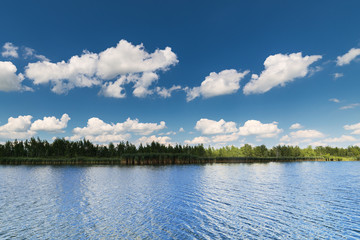 Clean lake and beautiful blue sky with clouds