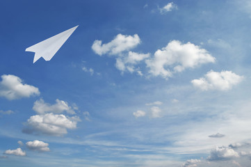 Naklejka na ściany i meble Plane paper flying over blue sky, Business leader concept