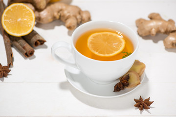 Healthy ginger tea ingredients on a wooden table