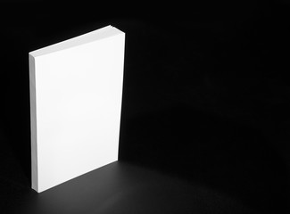 Real white book on a black background