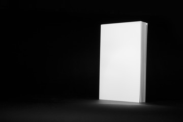 Real white book on a black background