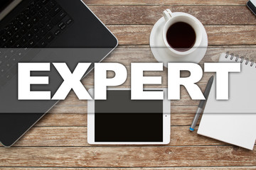 Tablet on desktop with expert text.