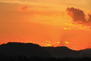 Fototapeta premium sky in sunset and motion cloud, beautiful colorful twilight time with mountain silhouette