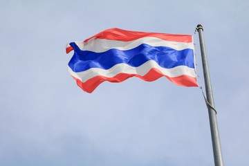 Thailand Flag Wave Flying with blue sky background.