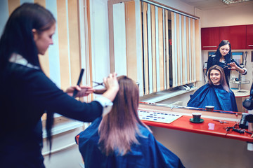 Picture showing hairdresser holding scissors and comb