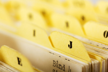 Close up of alphabetical index cards in box