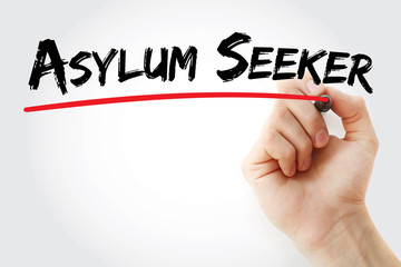 Hand writing Asylum seeker with marker, concept background