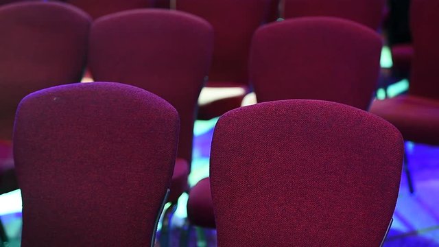 Stage lights tests and conference chairs before event