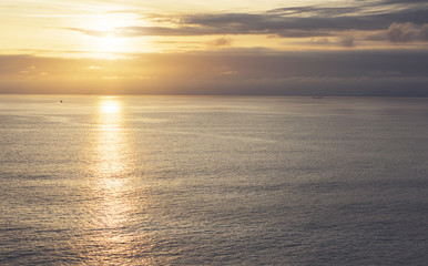 Clouds sky and sunlight sunset on horizon ocean. Silhouette person on background seascape dramatic atmosphere rays sunrise. Relax view waves sea, mockup nature evening concept perspective sunrise