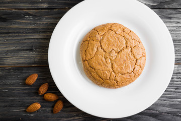Cookies with almonds on a white plate. Tasty dessert.