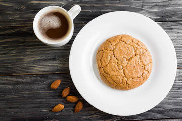 Cookies with almonds on a white plate. Tasty dessert.
