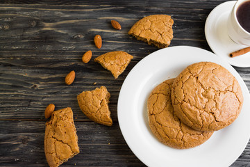 Cookies with almonds on a white plate. Tasty dessert.