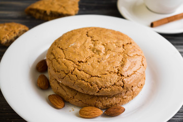 Cookies with almonds on a white plate. Tasty dessert.