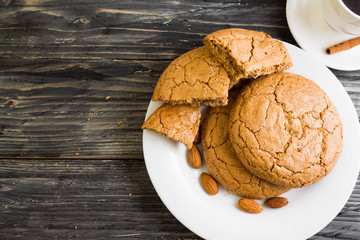Cookies with almonds on a white plate. Tasty dessert.