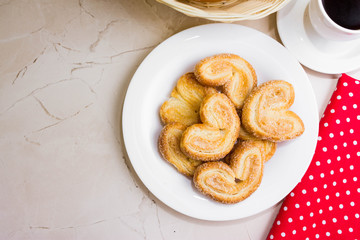 Berliner Cookies in a white plate on a marble table. Tasty dessert.