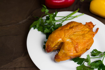 Smoked chicken breast on a marble table and ingredients. A delicious dish.