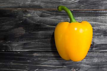 Bulgarian pepper on a wooden background in rustic style