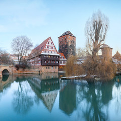 Naklejka na ściany i meble Winter Henker haus and Henkersteg bridge over Pegnitz river in Nuremberg, Bavaria, Germany