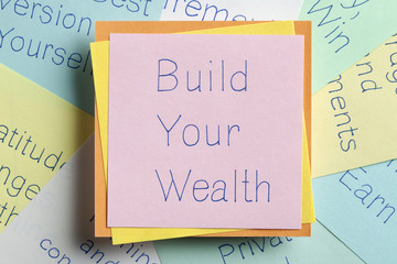 Build Your Wealth written on a note