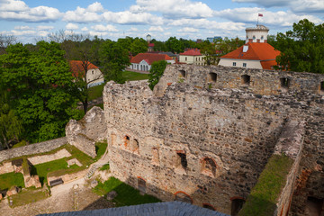 Fototapeta na wymiar Aerial view of beautiful ruins of ancient Livonian castle in old town of Cesis, Latvia. Greenery and summer daytime.