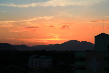 Sunset in sky beautiful colorful evening     with city silhouette