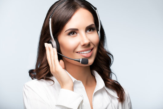 cheerful customer support female phone operator in headset
