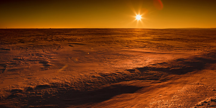 Martian sunset (Mars planet) red landscape. Looks like cold desert on Mars. A huge field of ice