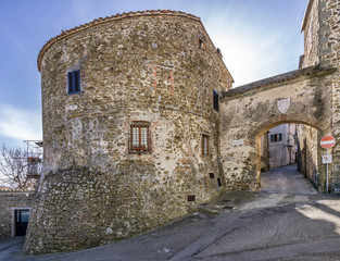 The beautiful Porta Fiorella with the tower at the entrance to the historic center of Manciano,...