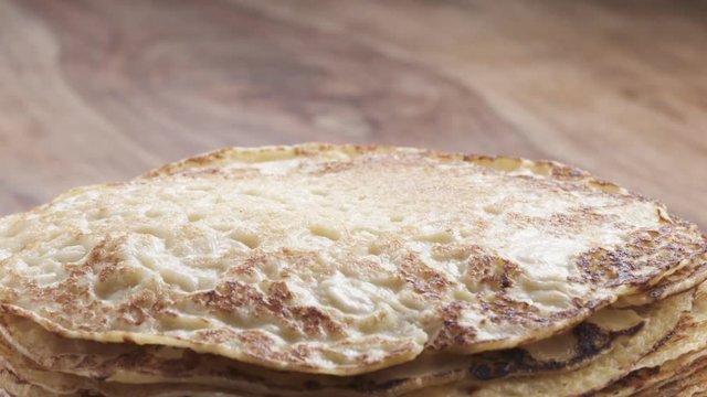 Slow motion of blin or crepe falling on stack, 180fps prores footage