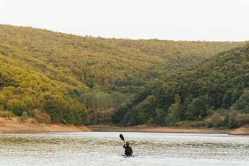Obraz na płótnie Canvas Being alone on the lake paddling.