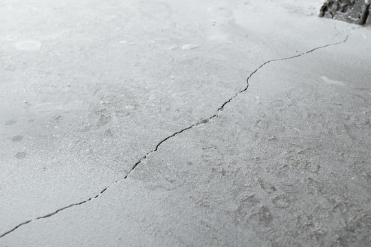 Crack in cement floor from shrinkage of house