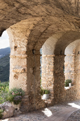 antique stone archways overlooking mediterranean countryside
