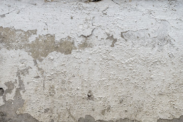 old cracked plaster on the cement wall. grunge textured background