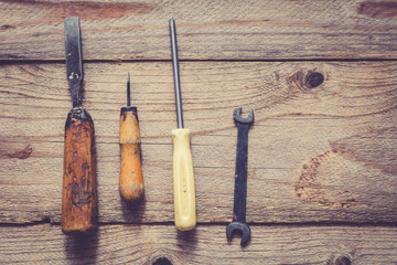 Old work tools on wooden table background. Copy space for text