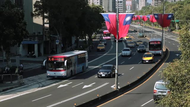 Major cities in Taiwan, capital Taipei, have to deal with a growing number of cars, motorbikes and other traffic on the road with the Taiwan Flag -Dan