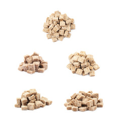 Pile of brown sugar cubes isolated